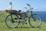 Bike fitted with motor parked at lighthouse